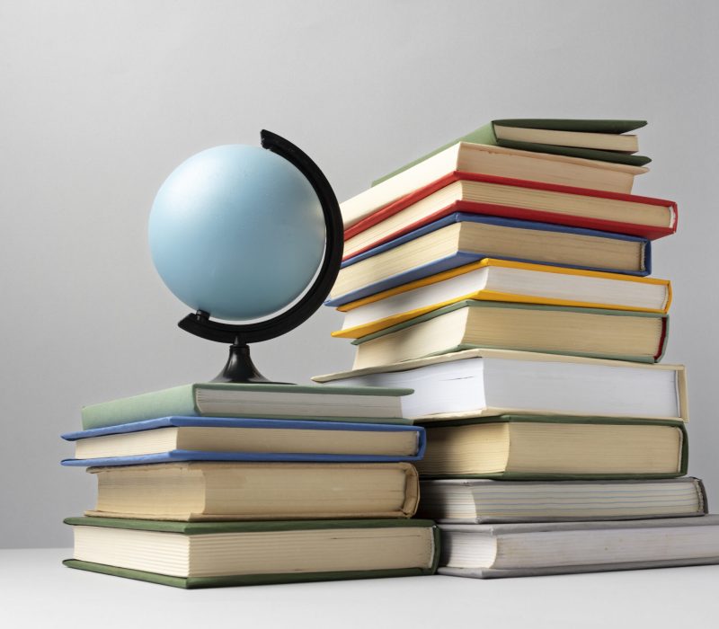 front-view-stacked-books-earth-globe-education-day